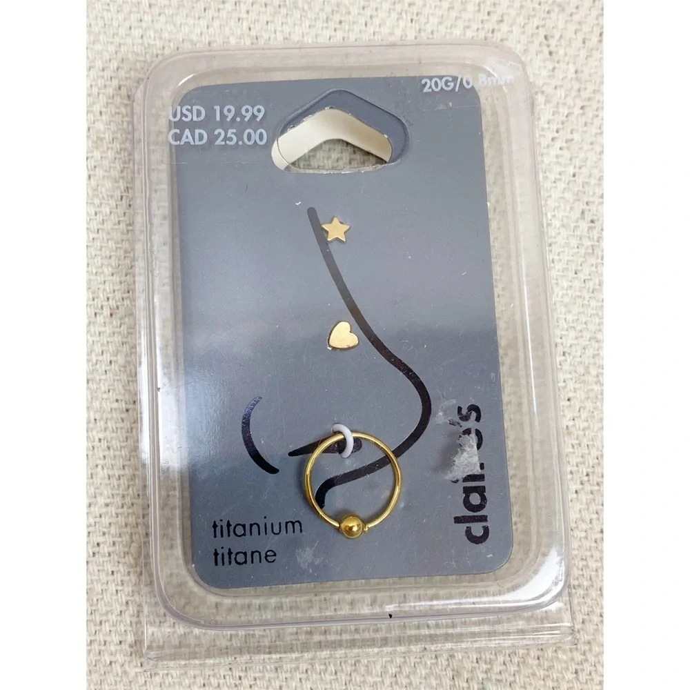 Claire's 20 gauge Titanium Gold tone Nose Ring Set of 3 star heart hoop